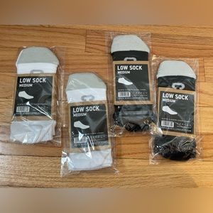 Four pairs. NOBULL low socks. 2 white pair, 2 black pair.